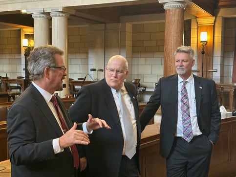 From L: Sen. Bostelman, Ross McConnell, and James Chesnut discuss Bill 568)